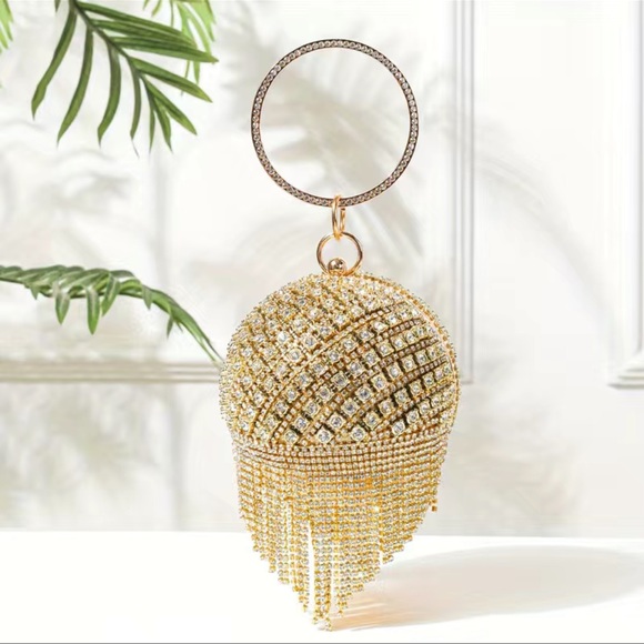 Round golden clutch bag